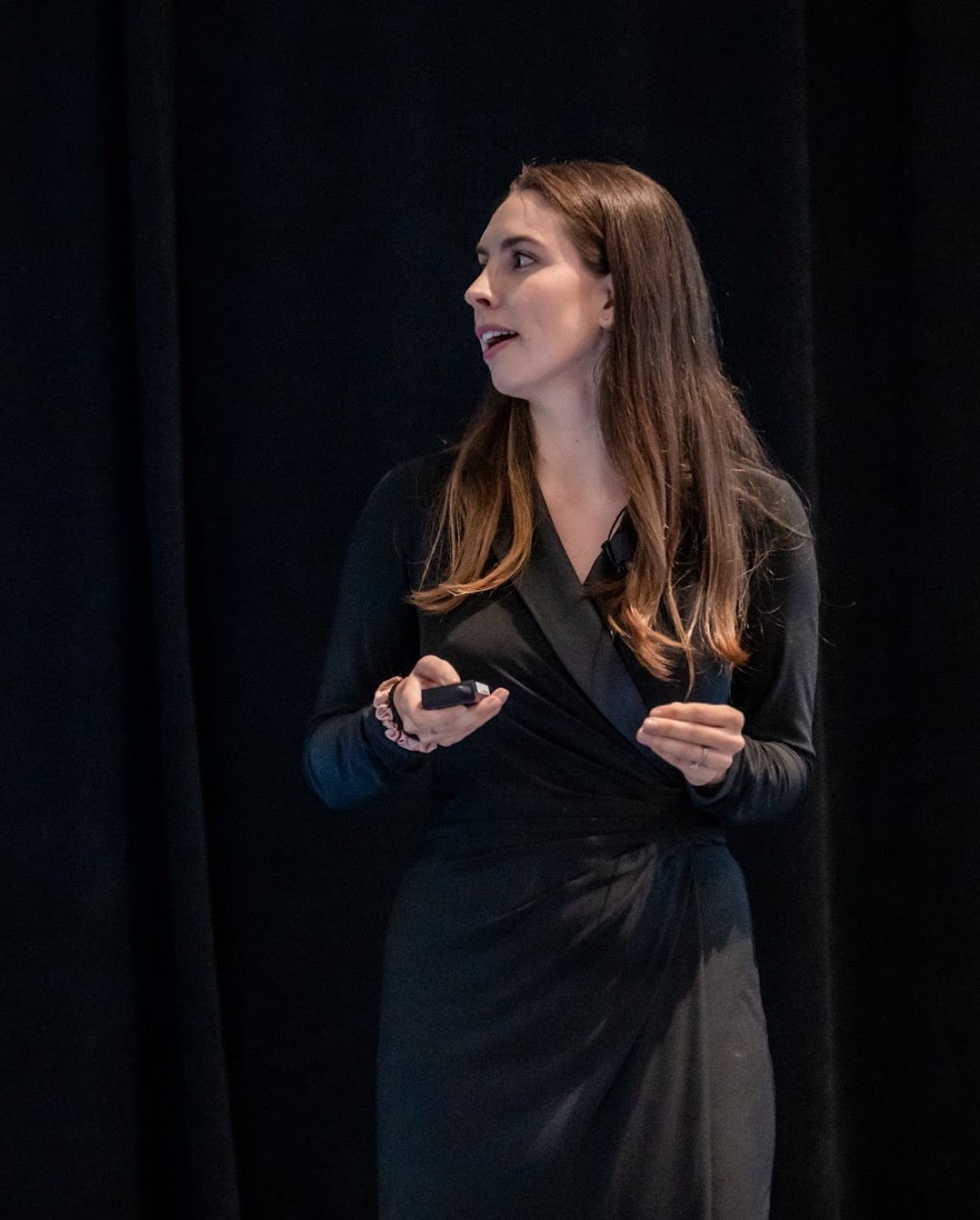 Speaker presenting on stage at the FUTURE conference.