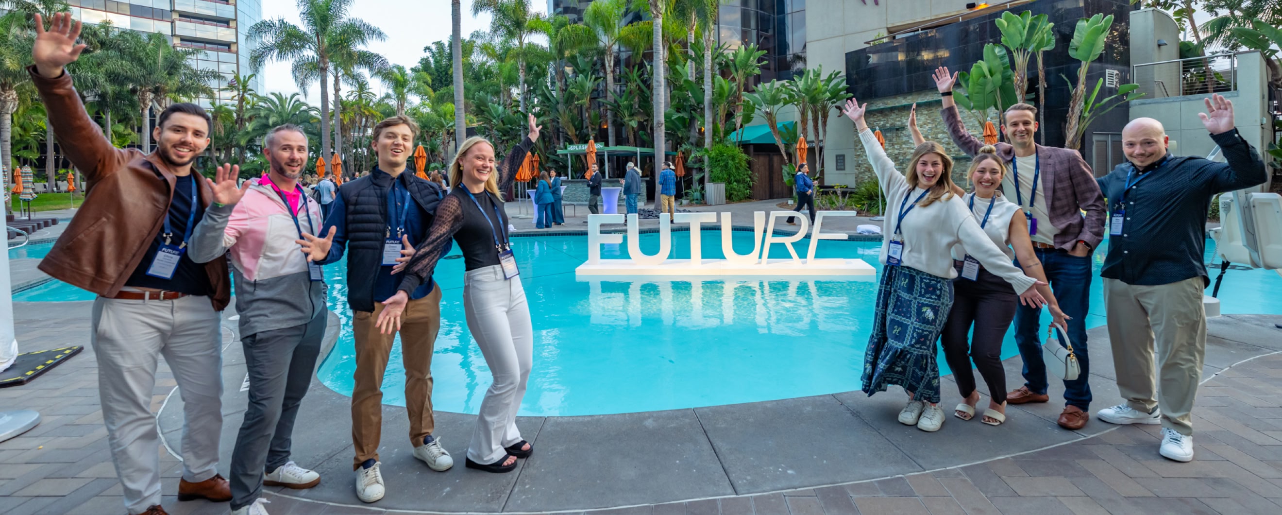 Attendees enjoying a FUTURE conference event in front of a pool