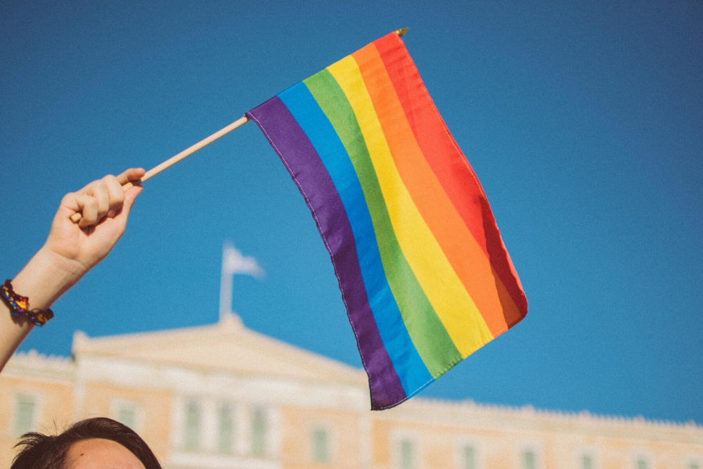 Pride Rainbow flag in front of building image