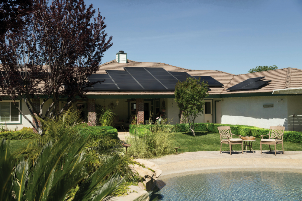 House with solar panels, sustainability