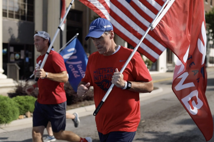 Men carrying flags in the 9-11 Moving Tribute