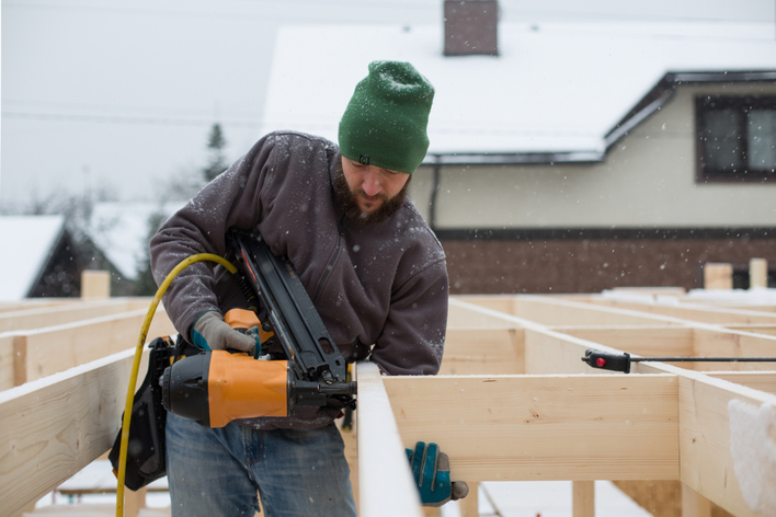 Contractor working on home remodeling project in the winter