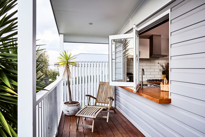 Deck with window that opens to kitchen