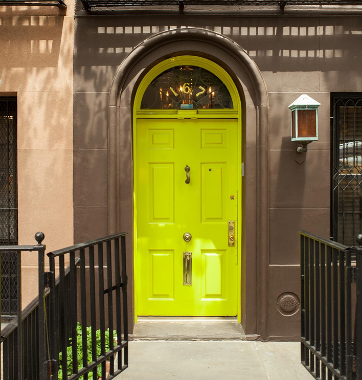 Lime door on a city apartment