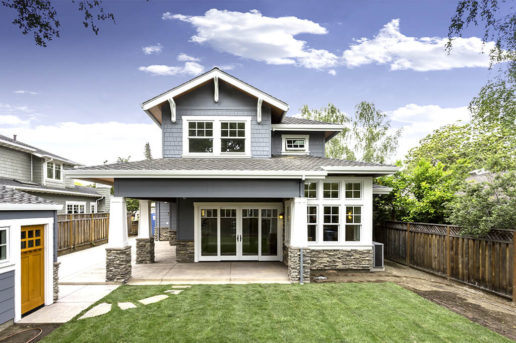 Back view of blue Craftsman home