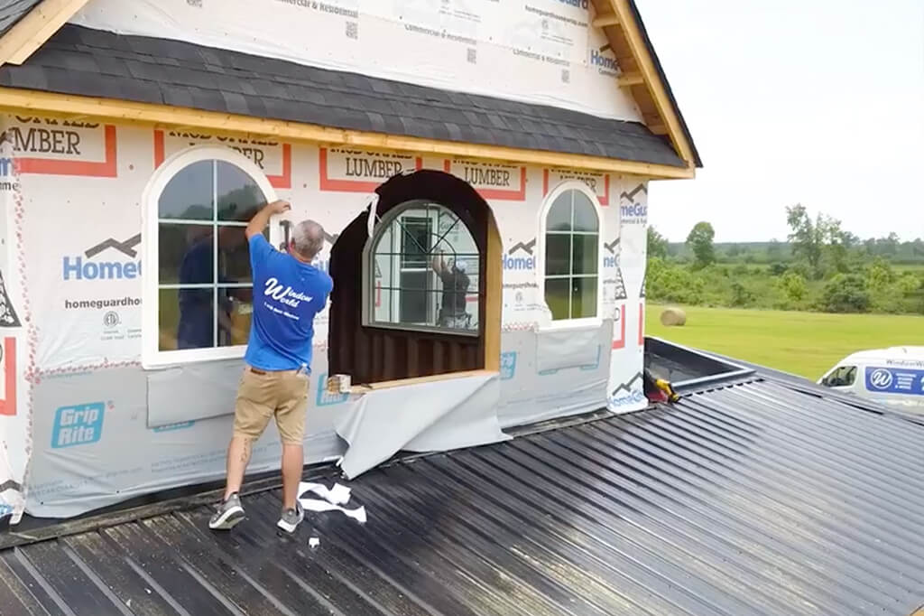 Window World professional installing windows in a home