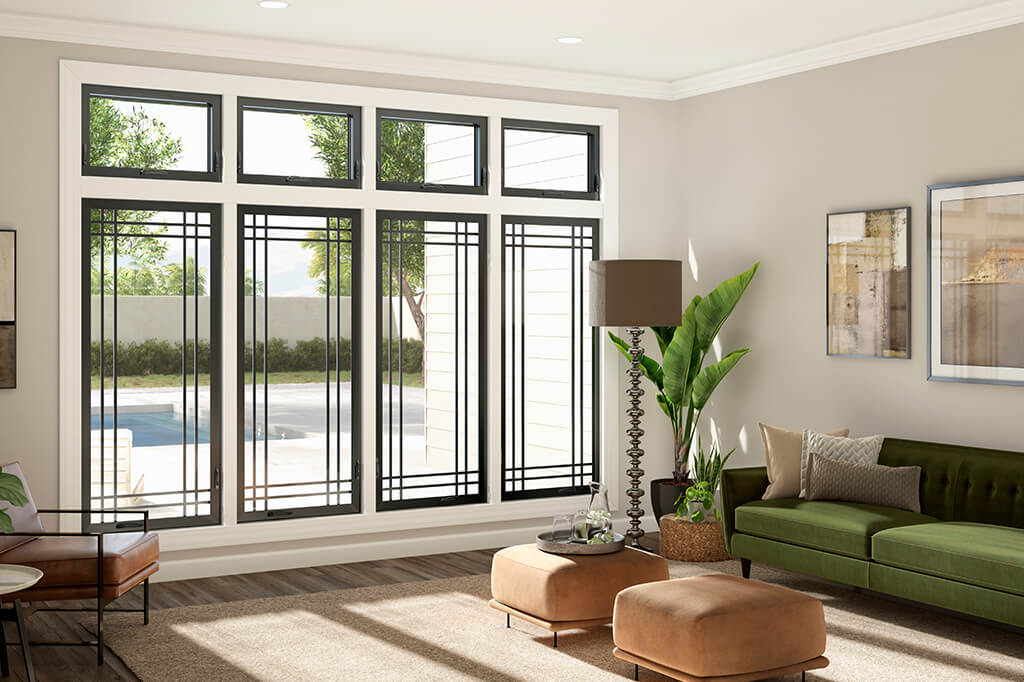 Interior view of black frame windows in a living room with light colored walls