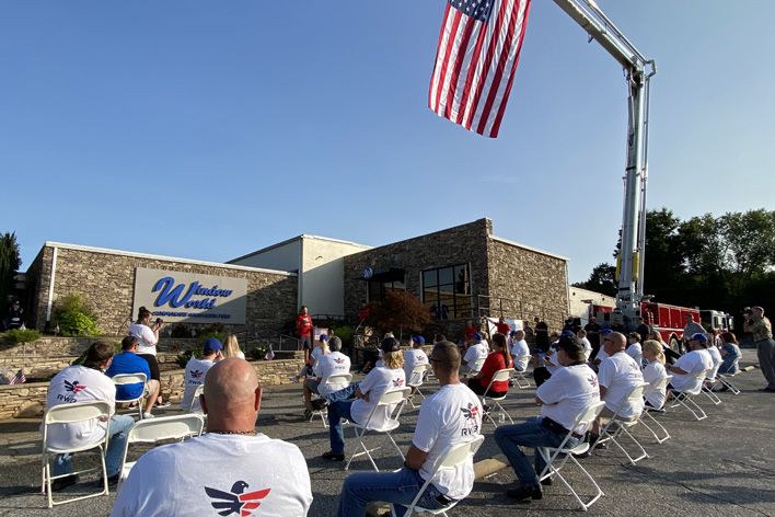 Employees gather for the 9-11 Moving Tribute at Window World, Inc.