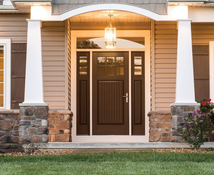 Chestnut-colored entry door on a beige house