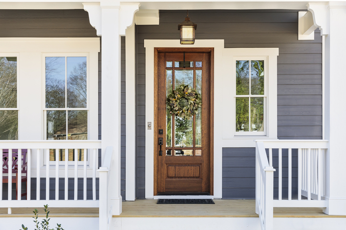 Front door with a Christmas wreath