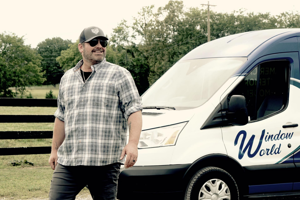 Country music star Lee Brice in front of Window World van