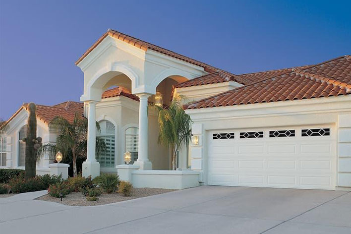 White garage door on a Southwest style house