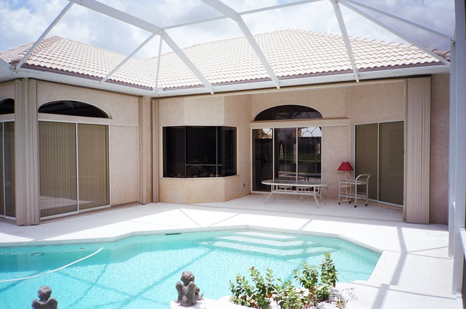 Indoor pool featuring retracted accordion shutters