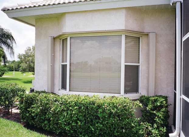 Exterior shot of retracted accordion shutters for windows