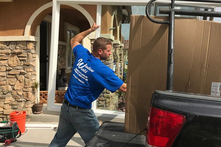 Window installer unloading a truck