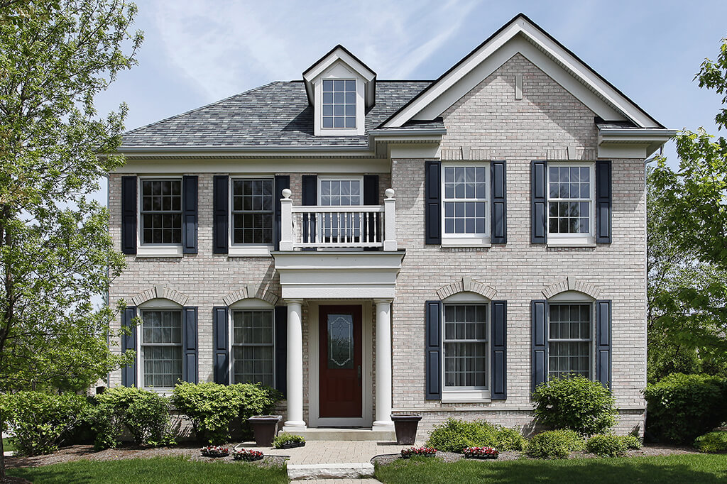Traditional style home with shutters and double-hung windows