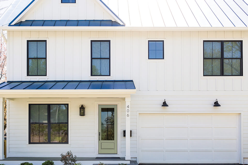 White farmhouse with black frame windows