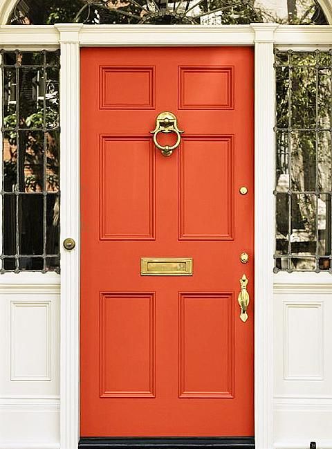 Orange front door with white trim