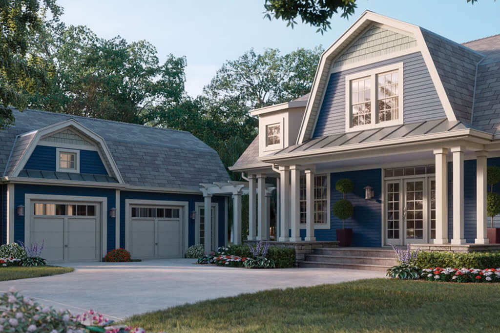 Beautiful house covered in blue vinyl siding