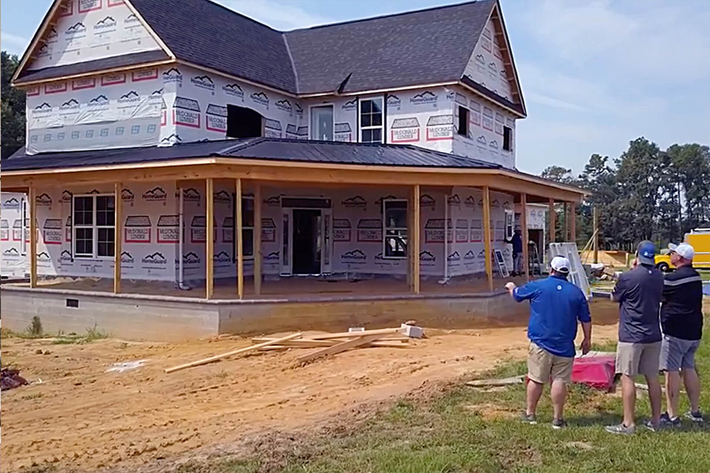 Home remodeling contractors speaking with homeowner