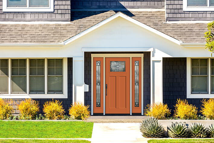 Orange front door on a house