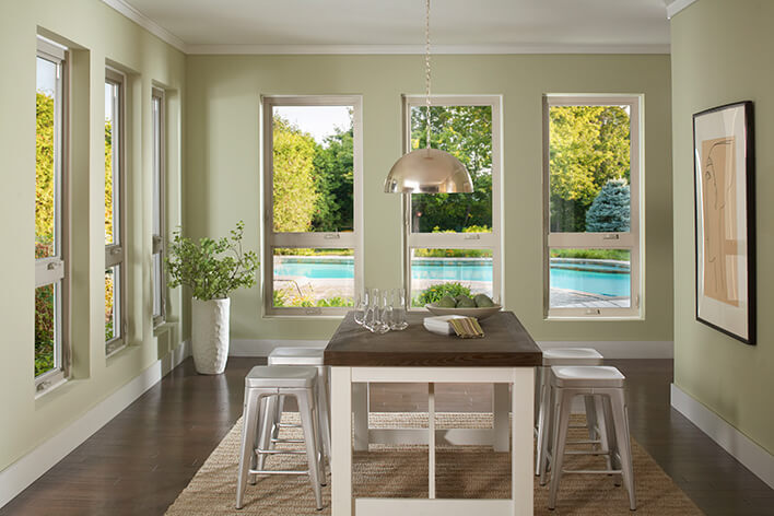 Dining room windows creating a focal point of the outside pool
