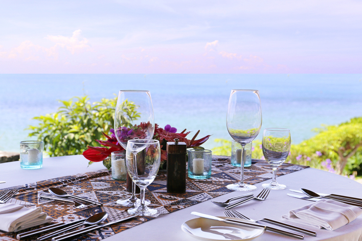 An outdoor table setting facing the ocean
