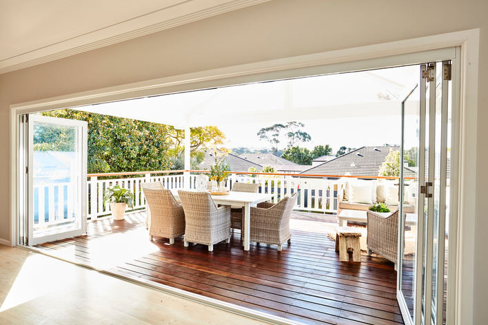 Folding patio doors looking out on a deck