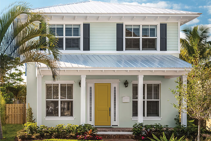 Yellow front door on a beach house