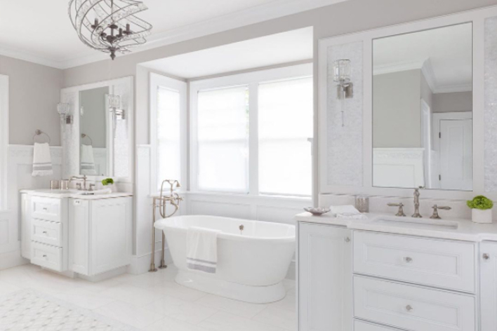 A clean white bathroom with elegant styling