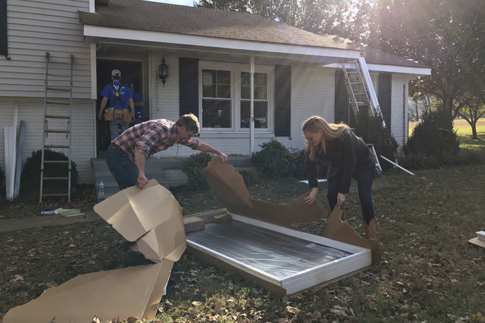 Couple opening a new front door