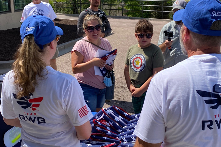 Community members receive their new American flag