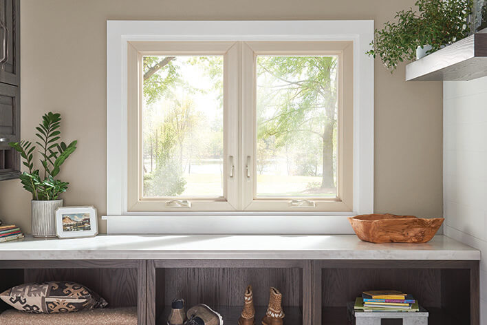 A laundry room with casement windows