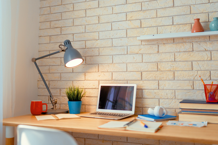 An office desk with a charming lamp