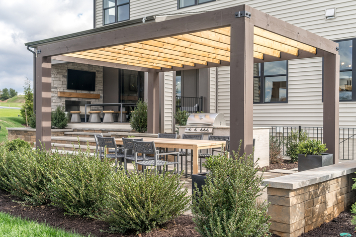 A backyard pergola on an outdoor deck