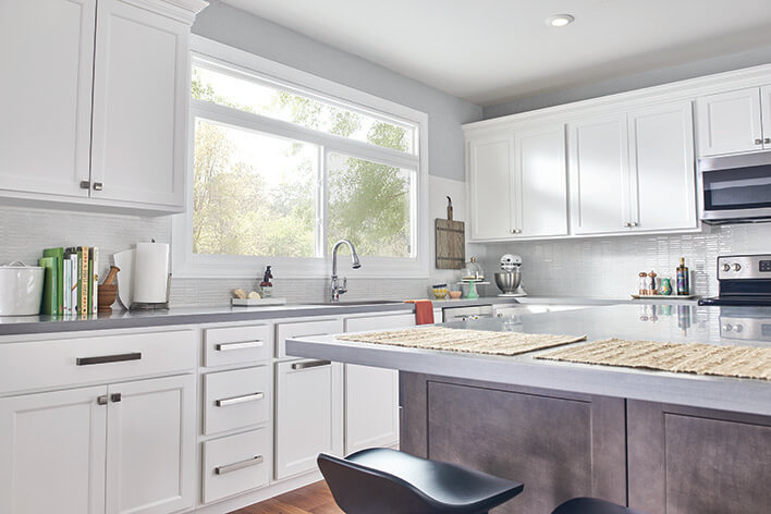 A clean kitchen with white cabinets