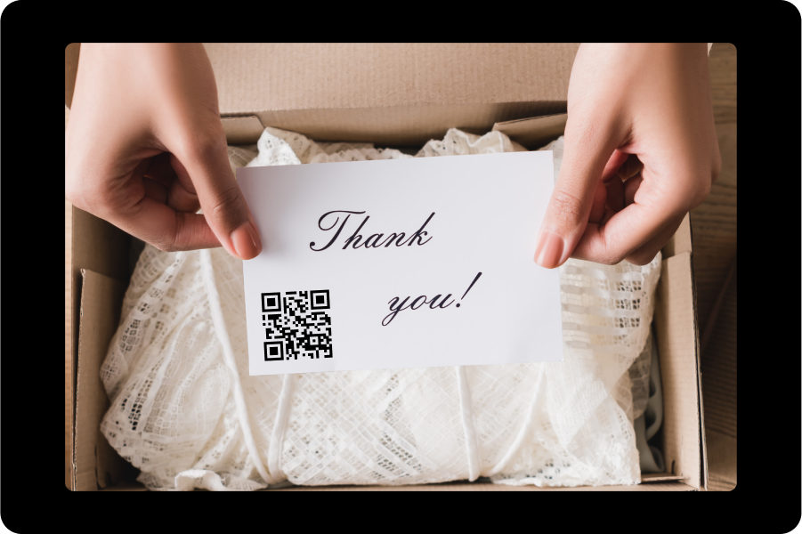 A 'Thank You' note with a QR code included in a product package, encouraging app downloads.