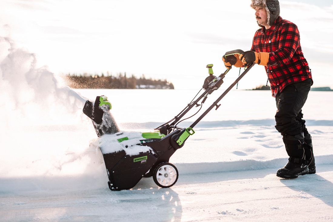 men-running-snow-blower