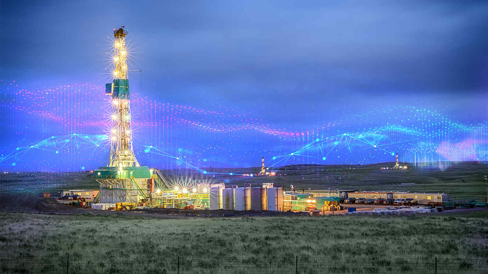 Oil rig at sunset with digital overlay graphics