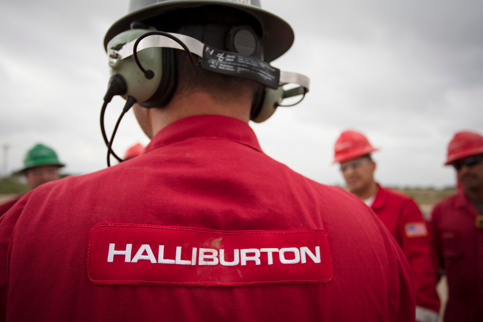 Image of four halliburton engineers at workplace