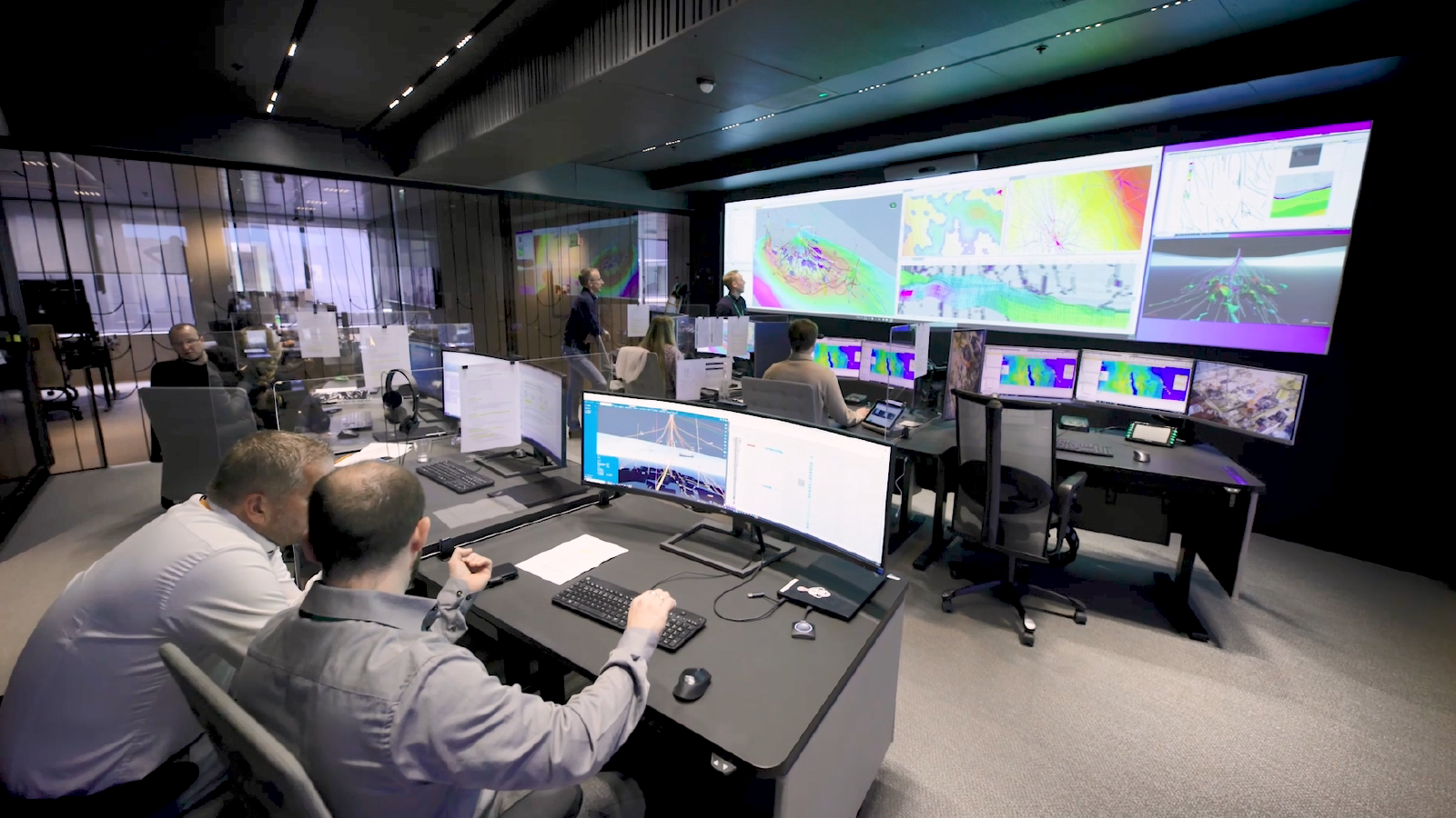 Employees working in office on asset engineering