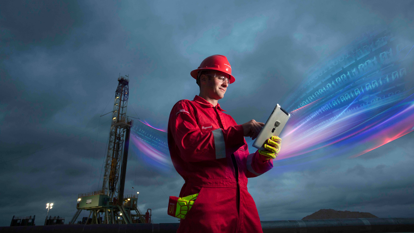 Halliburton employee wearing red coveralls.