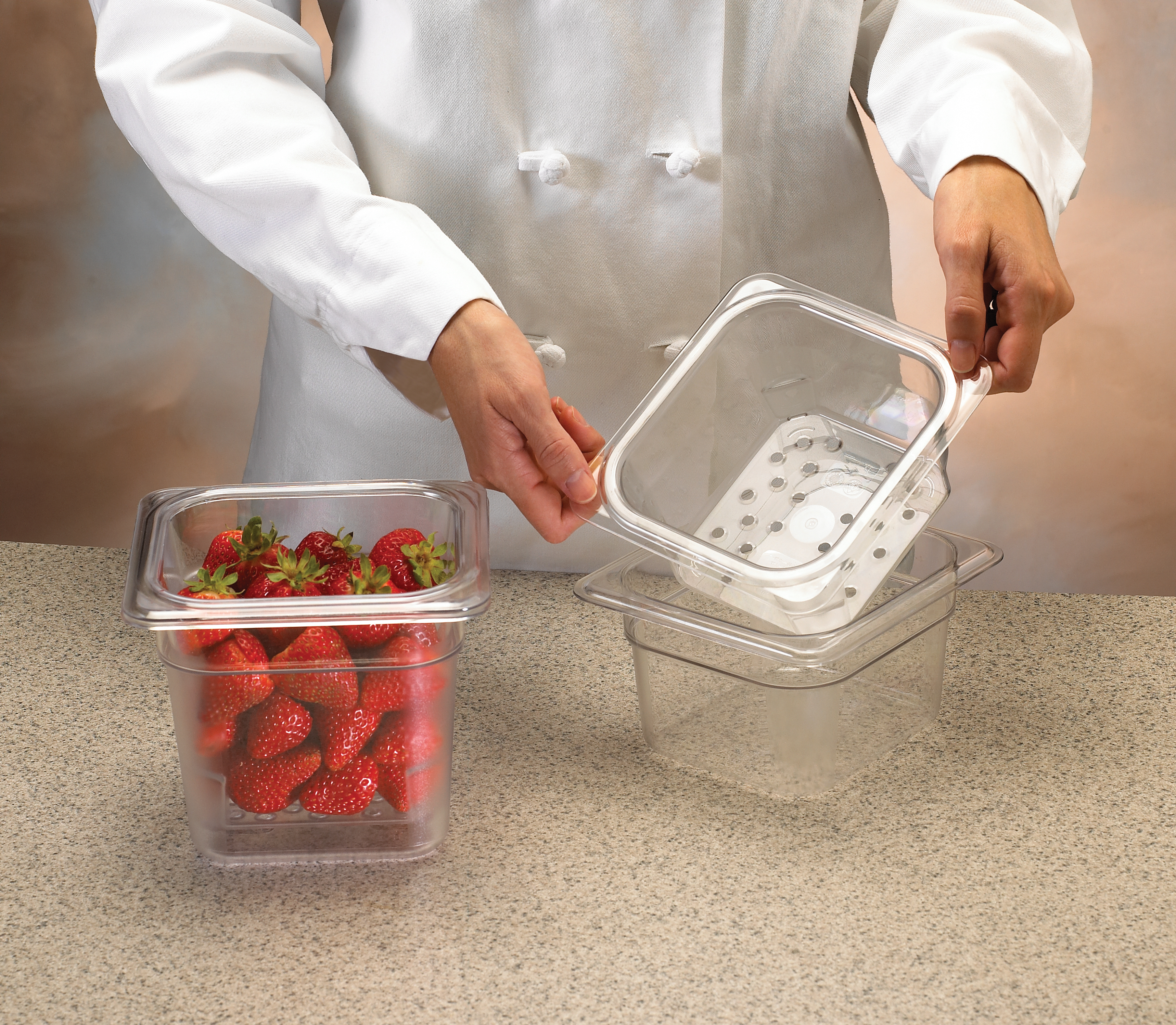 colander pans with strawberries