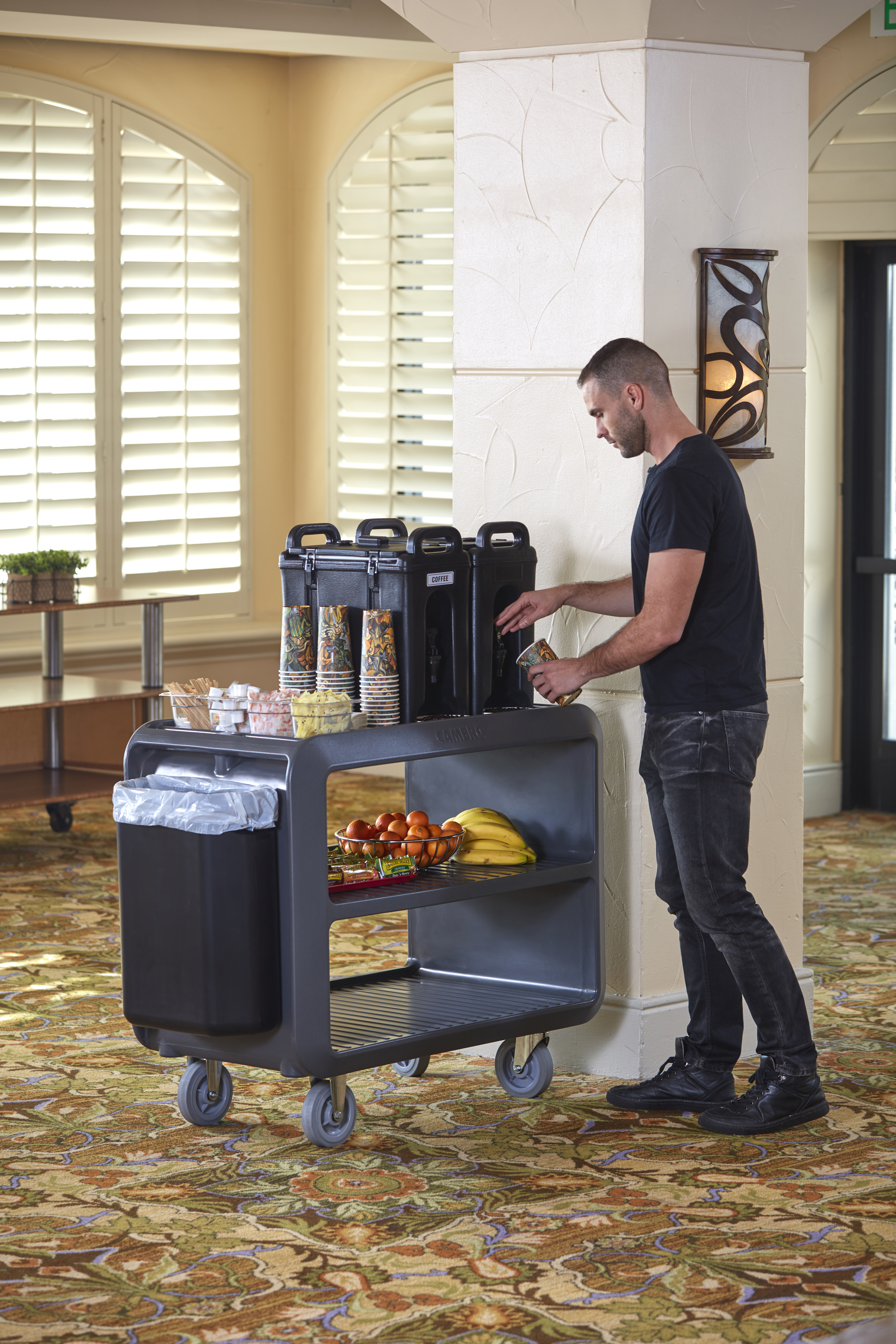 Gray Service Cart Pro being used front of house as a drink dispensing cart