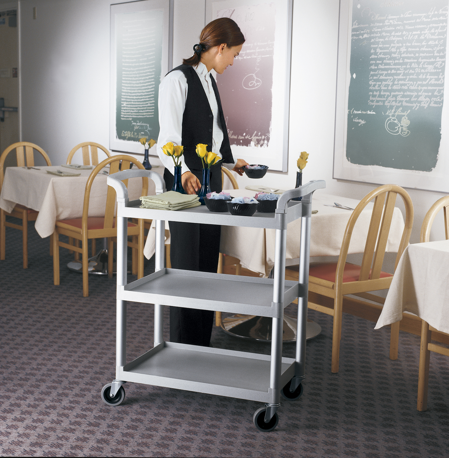 Gray KD Cart being used to bus cafe tables by a server