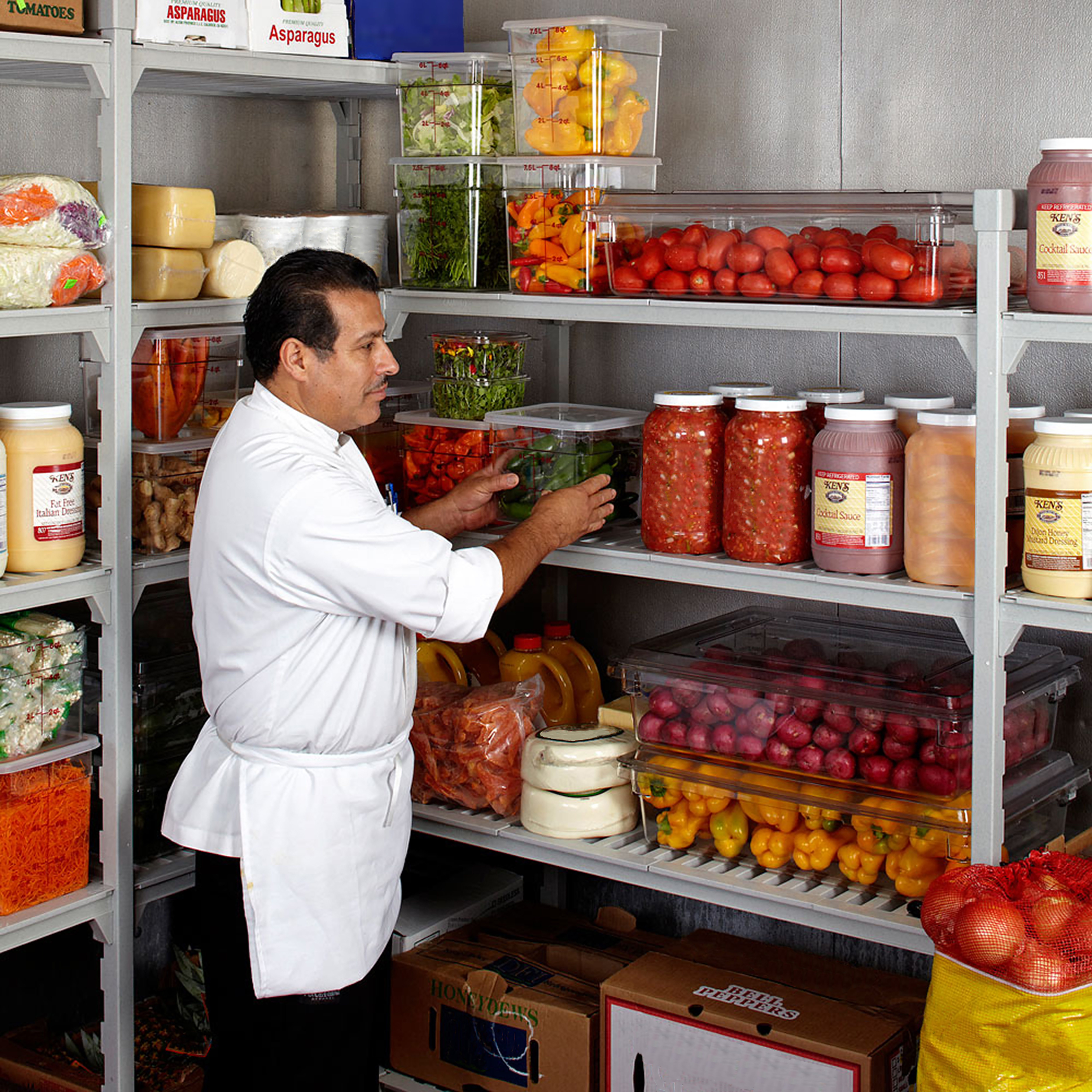 A chef places a CamSquare on Premium Series shelving full of perishable and non-perishable items