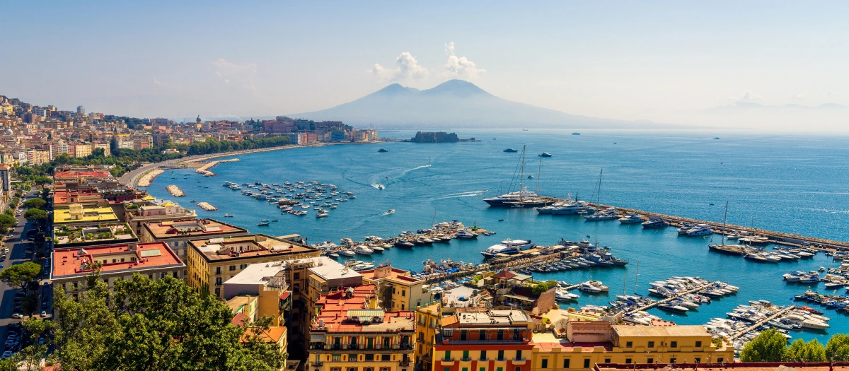 Bay and marina below Mount Vesuvius in Italy on a middle school Rome and Pompeii tour.