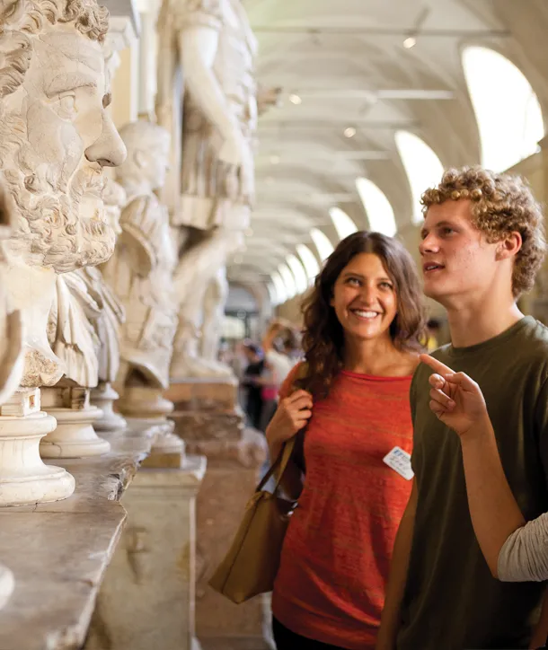 Two students in Italian museum enjoying an art tour of Europe.