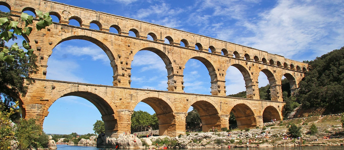 Pont du Gard Roman aqueduct arching over the river in southern France on the French Promenade tour.