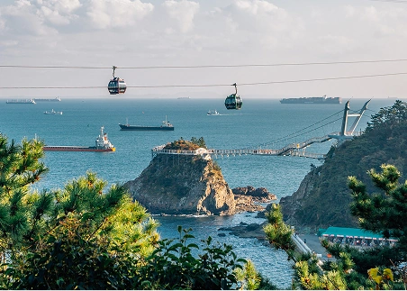 Ride a cable car over Songdo Beach in Busan and admire the sea and mountain landscapes
